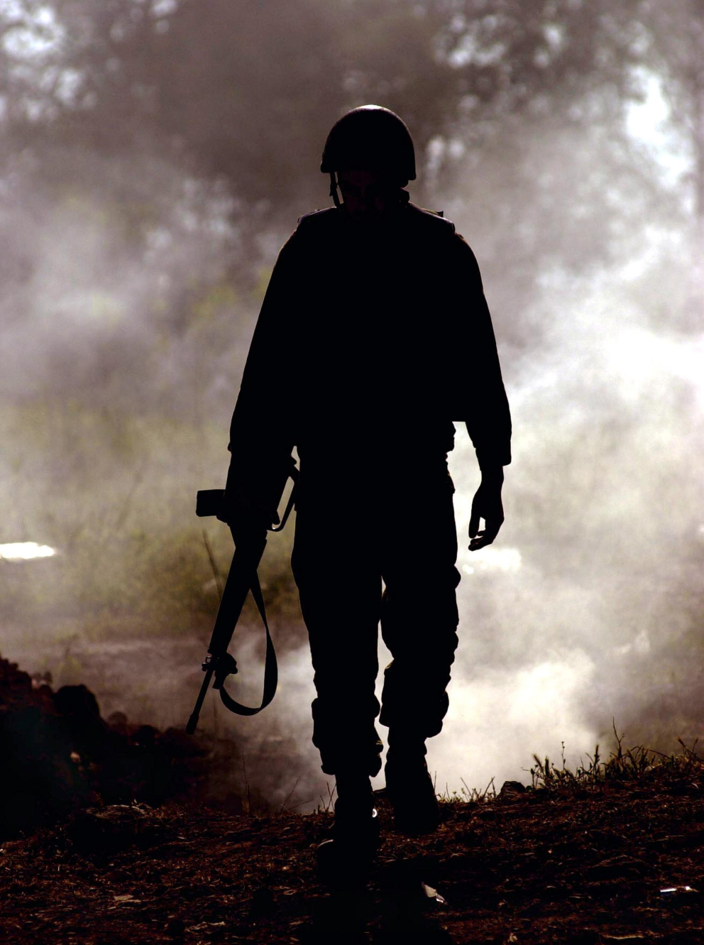 A silhouette of a soldier on the eve of IDF withdrawl from Jenin 18 04 2002 Raanan Cohen