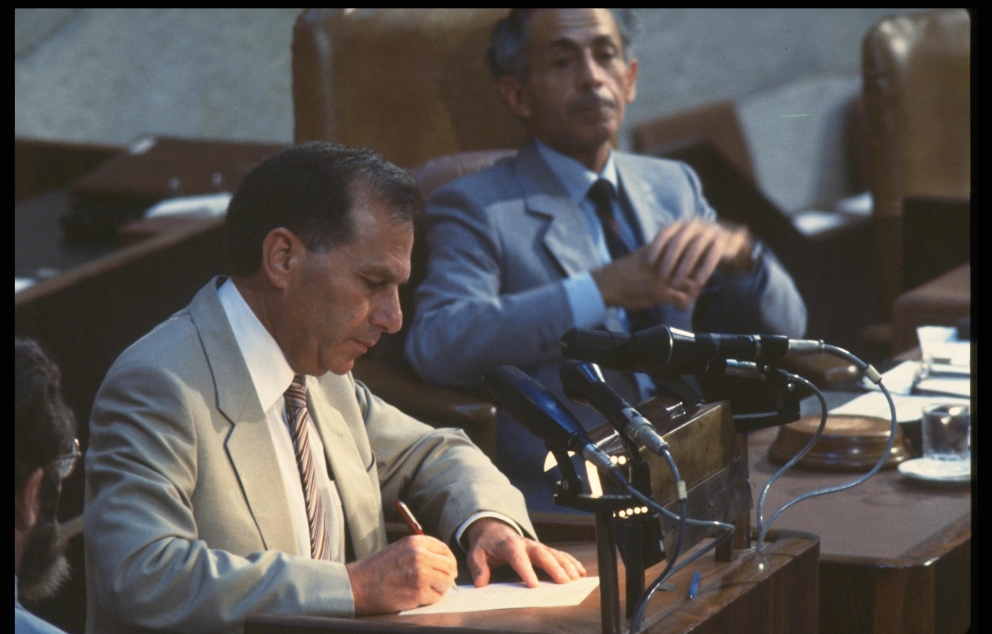 Communications Minister Amnon Rubinstein Signing A Loyalty Oath at the Knesset 1984 Nati Harnik