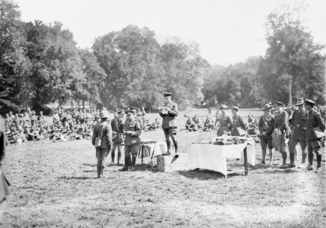 Lieutenant General Sir John Monash presenting decorations to members of the 4th Australian Infantry Brigade after their success in the Battle of Hamel